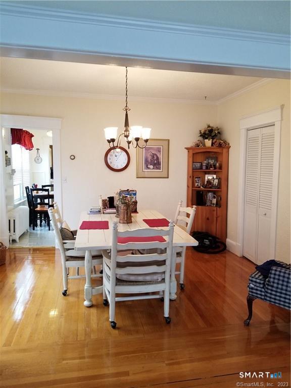 26 4th Street Hamden, CT 06514 - Photo 12 of 40 a living room with couches and piano table with wooden floor