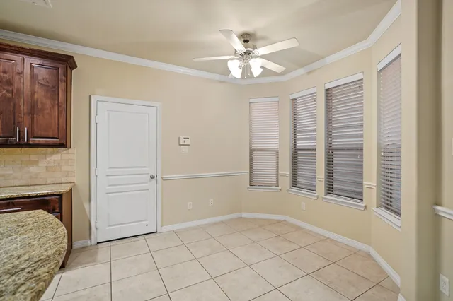 a view of an empty room with a fireplace