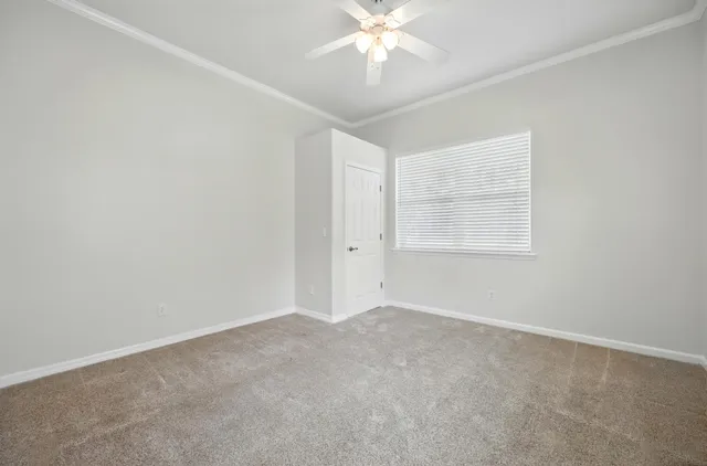 a view of an empty room with a fireplace