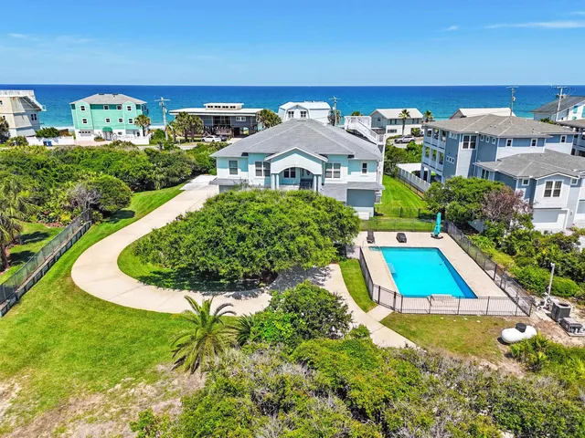 a front view of a building with garden