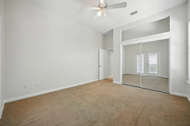 an aerial view of residential houses with outdoor space and river