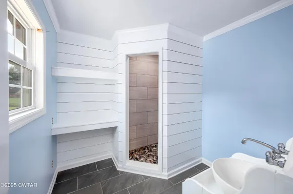 a bathroom with a bathtub and a sink