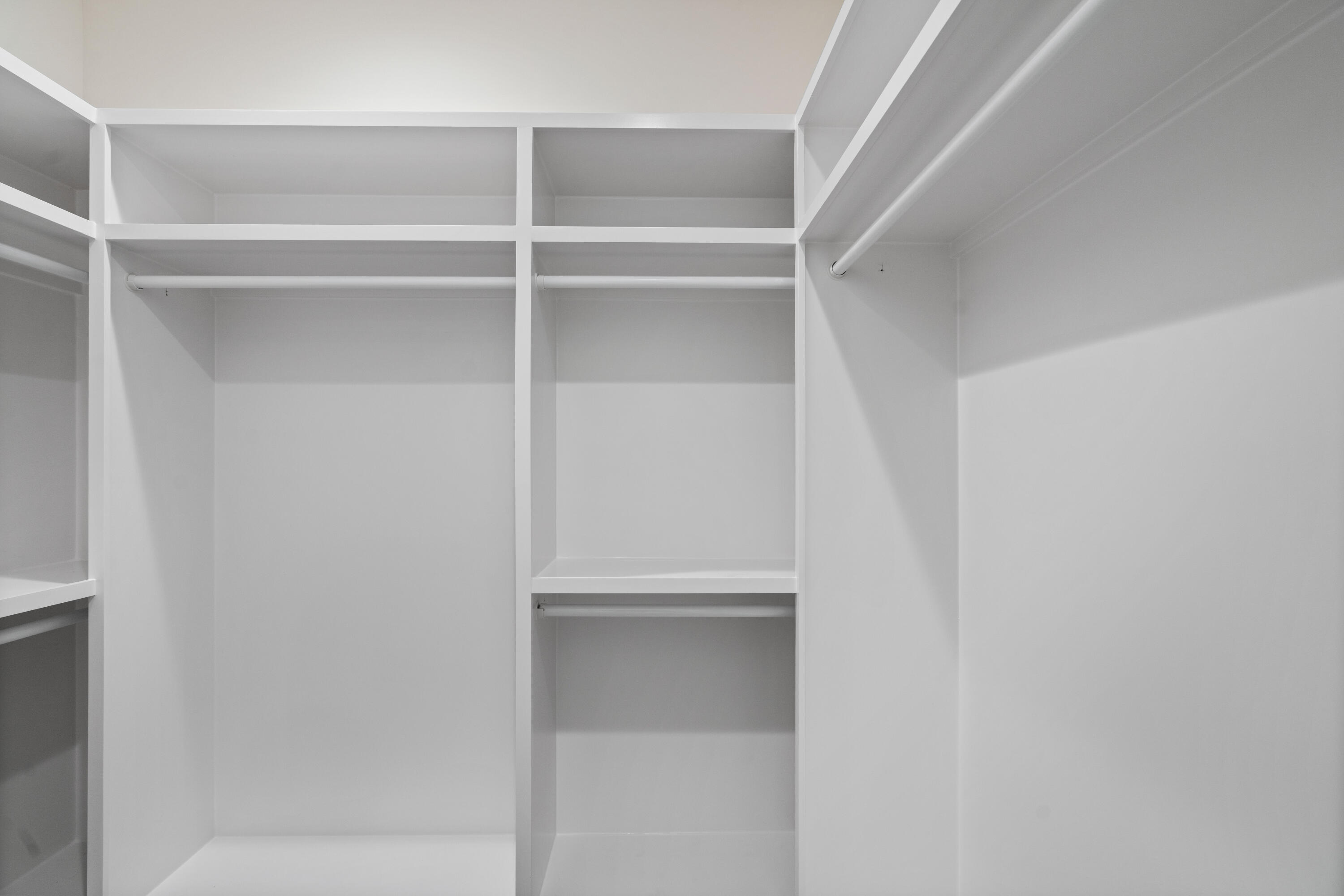 949 Bay Grove Road Freeport, FL 32439 - Photo 23 of 44 a view of walk in closet with empty racks