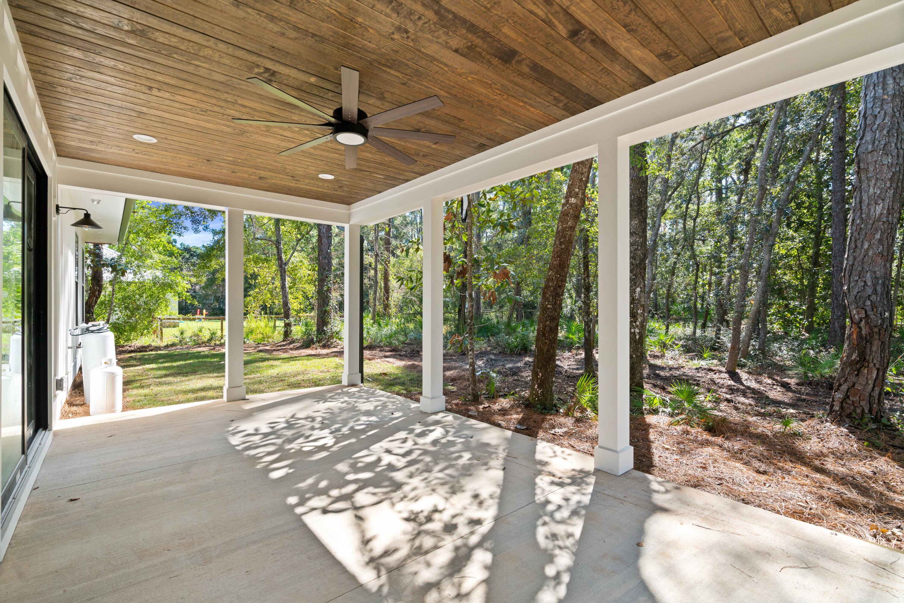 949 Bay Grove Road Freeport, FL 32439 - Photo 29 of 44 a view of a porch and garden