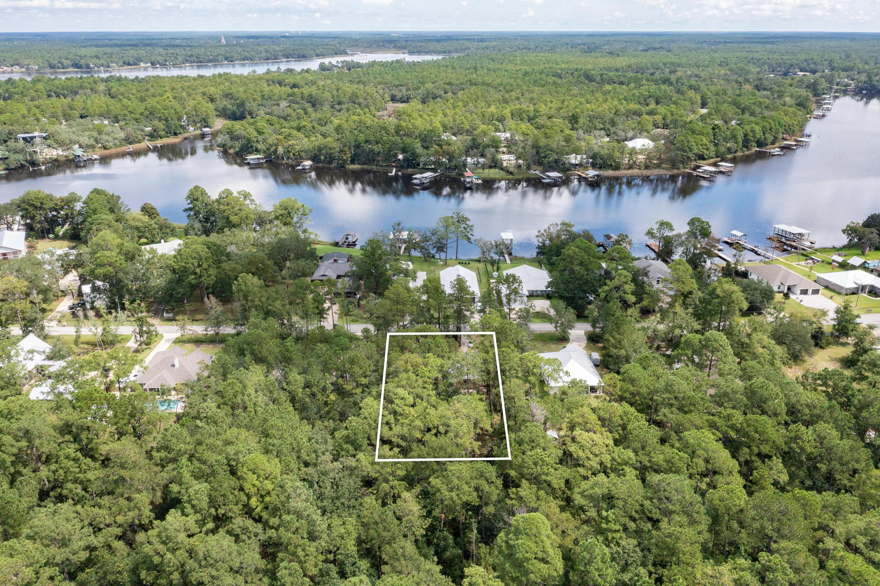949 Bay Grove Road Freeport, FL 32439 - Photo 36 of 44 a view of a lake with a lake