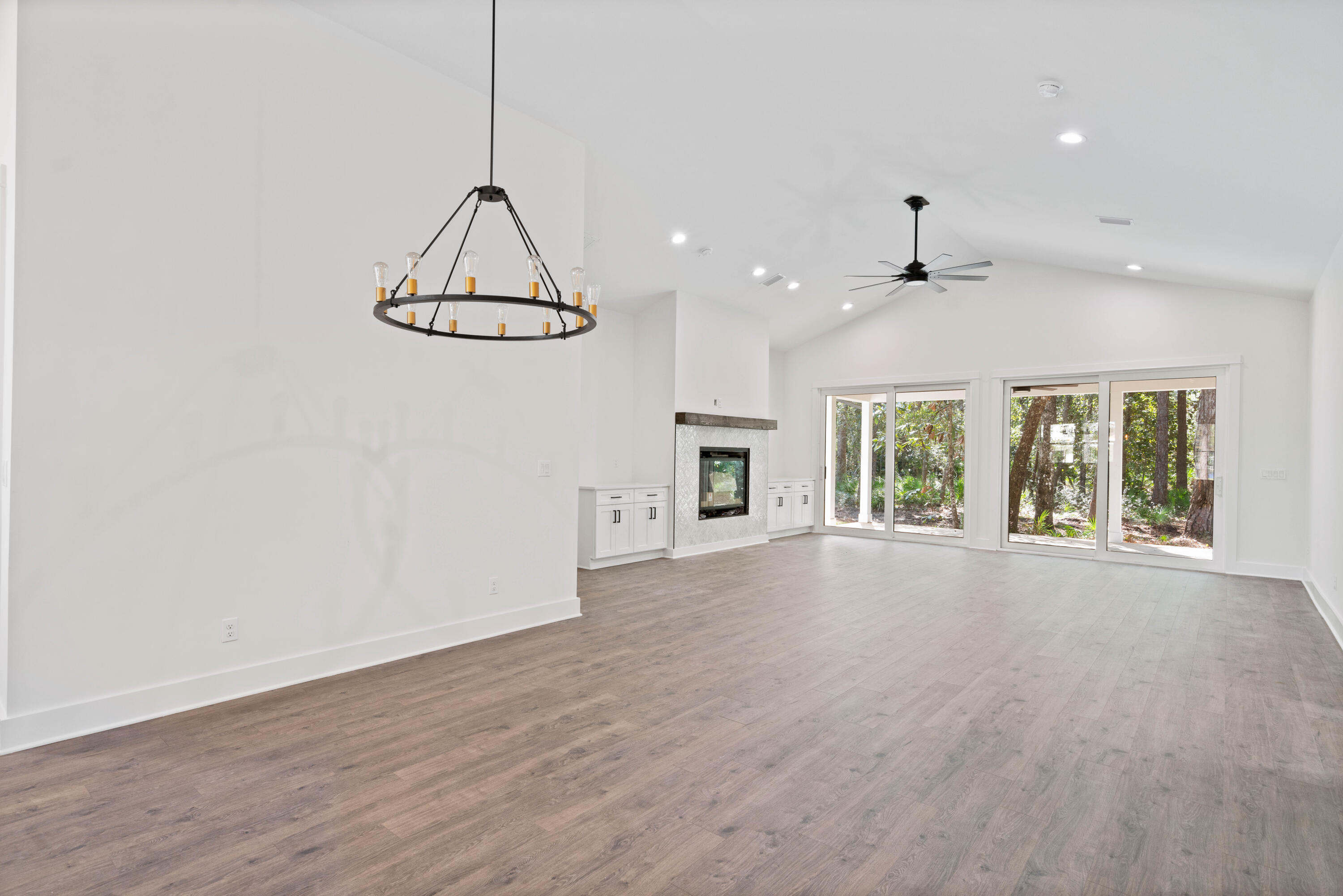 949 Bay Grove Road Freeport, FL 32439 - Photo 7 of 44 a view of a room with wooden floor and windows