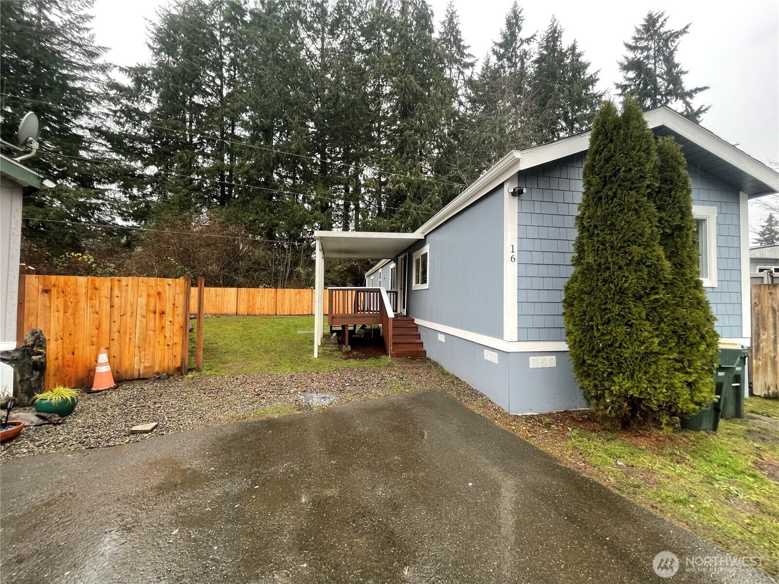 5705 Littlerock Road Southwest, Unit 16 Tumwater, WA 98512 - Photo 2 of 18 a view of a backyard with a garden