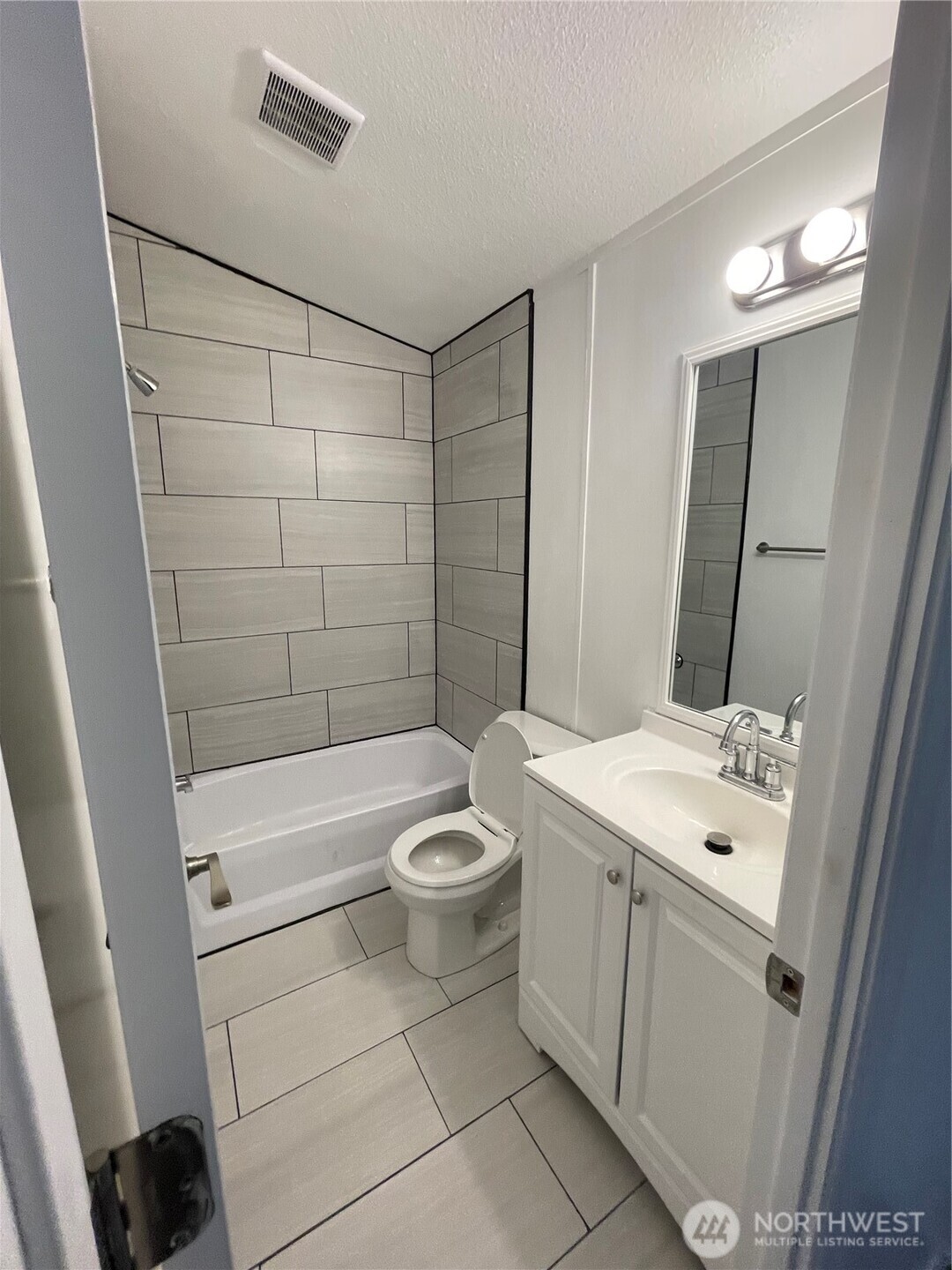 5705 Littlerock Road Southwest, Unit 16 Tumwater, WA 98512 - Photo 6 of 18 a bathroom with a sink a toilet and shower