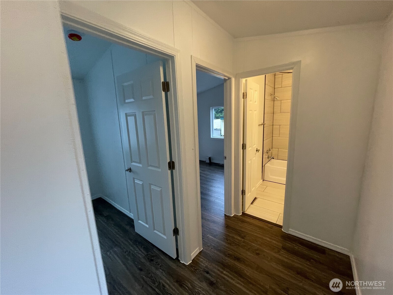 5705 Littlerock Road Southwest, Unit 16 Tumwater, WA 98512 - Photo 10 of 18 a view of a bathroom with wooden floor and a sink