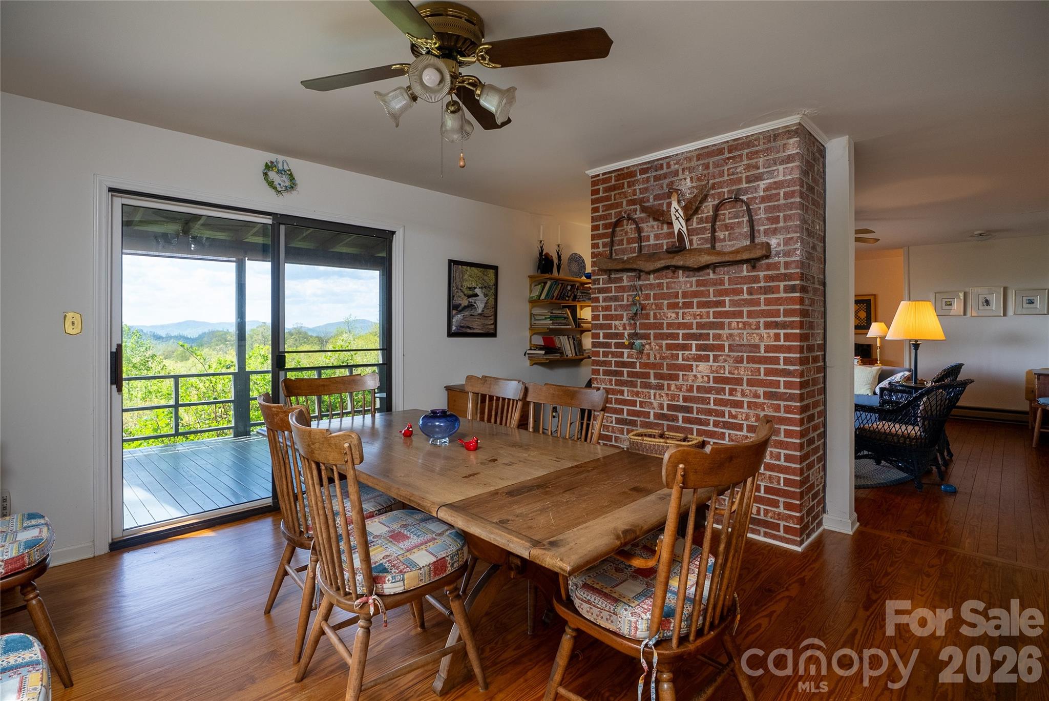 1412 North Bearwallow Road Fletcher, NC 28732 - Photo 14 of 30 a view of a dining room with furniture window and wooden floor