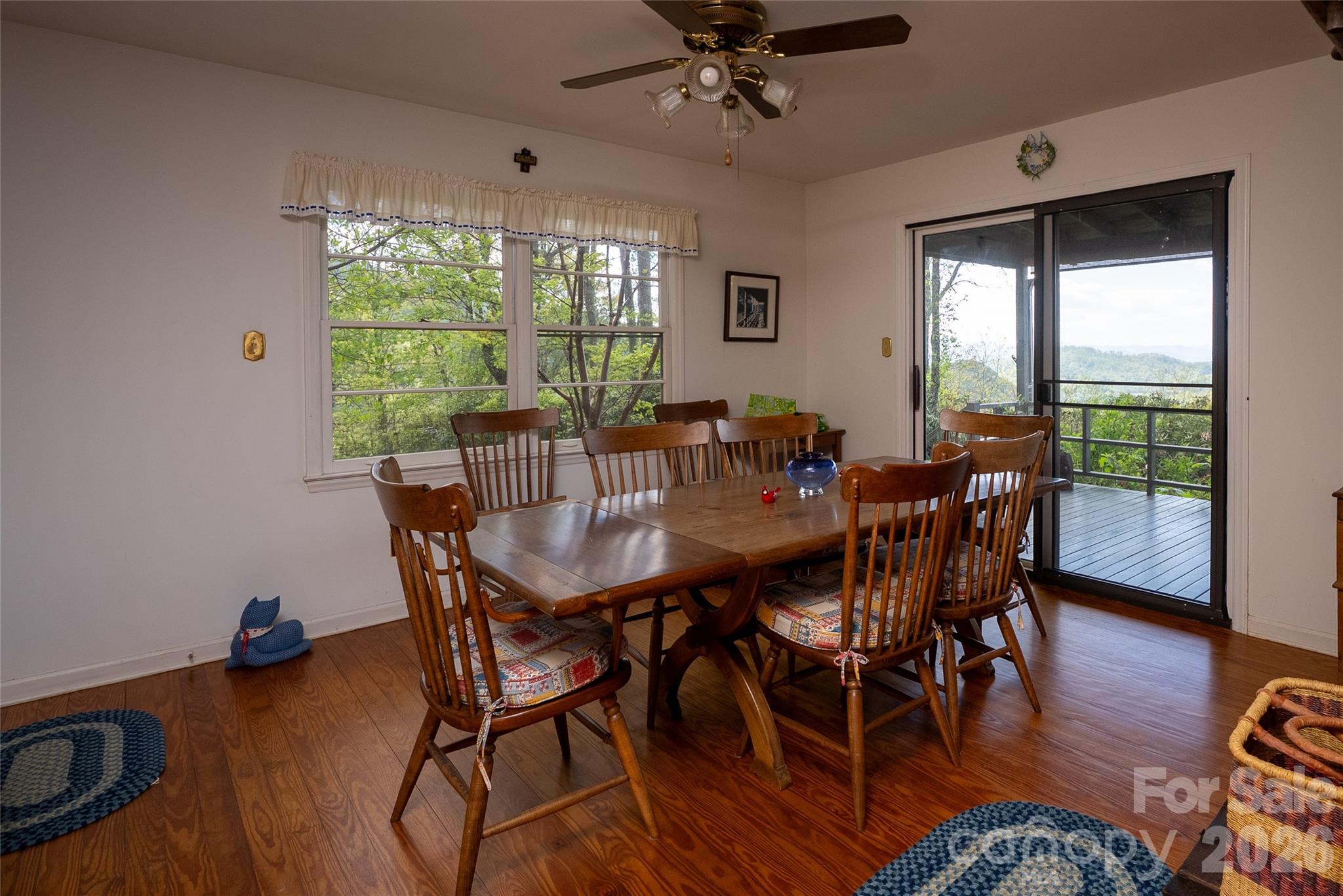 1412 North Bearwallow Road Fletcher, NC 28732 - Photo 17 of 30 a view of a dining room with furniture window and wooden floor