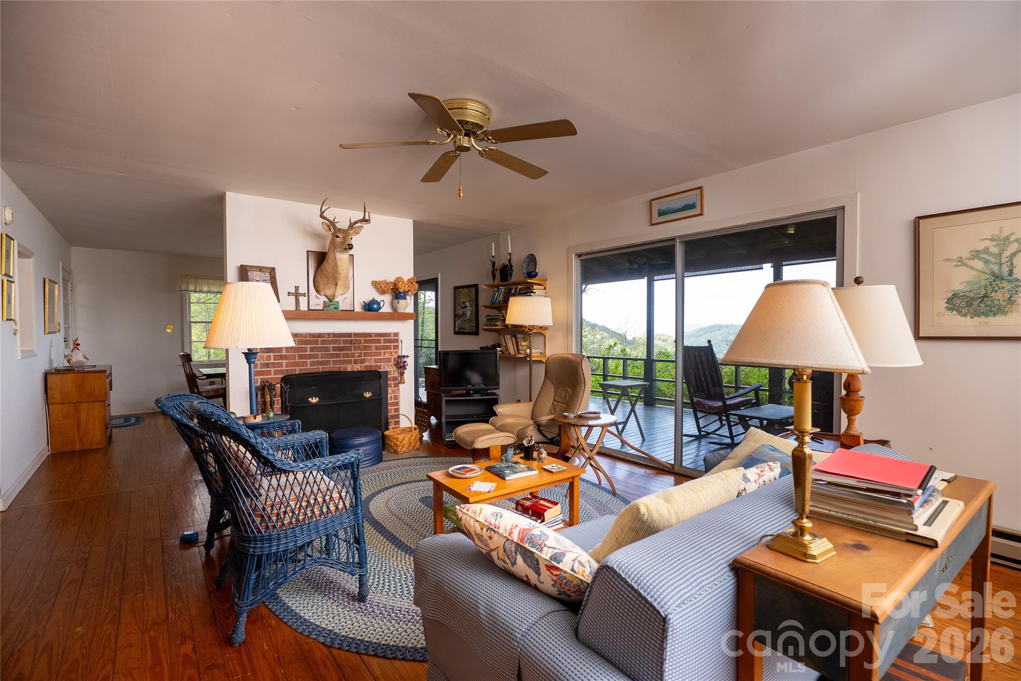 1412 North Bearwallow Road Fletcher, NC 28732 - Photo 20 of 30 a living room with furniture and a fireplace
