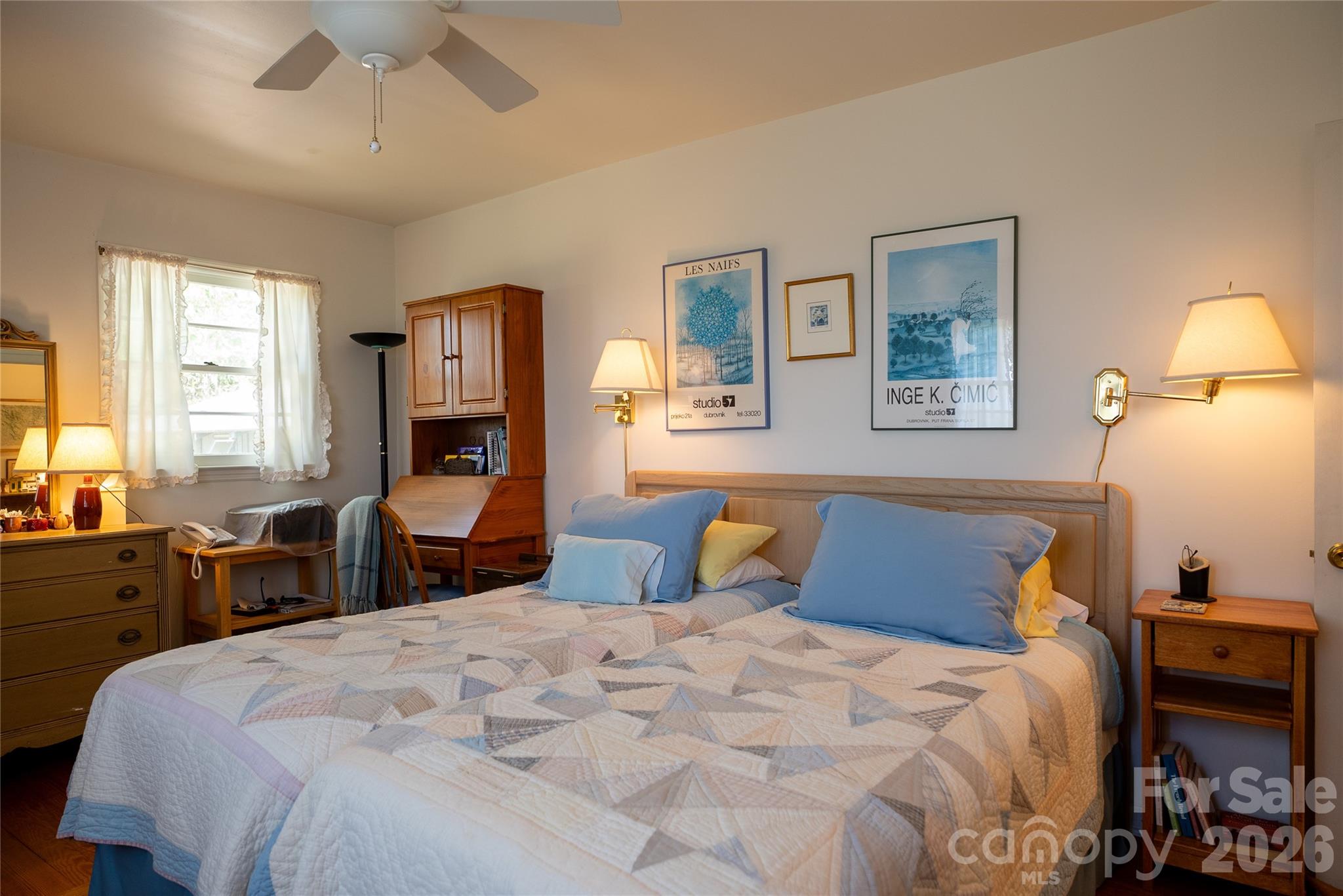 1412 North Bearwallow Road Fletcher, NC 28732 - Photo 21 of 30 a bedroom with a bed and a lamp on dresser