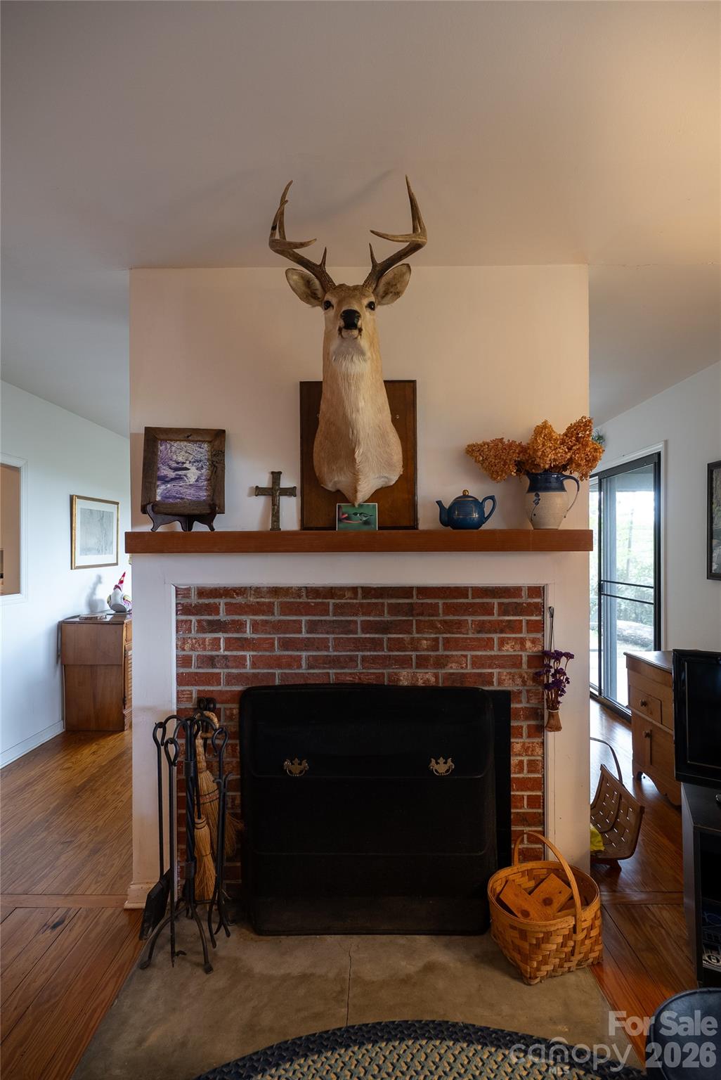 1412 North Bearwallow Road Fletcher, NC 28732 - Photo 24 of 30 a living room with furniture and a fireplace