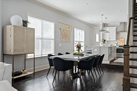 a view of a dining room with furniture window and wooden floor