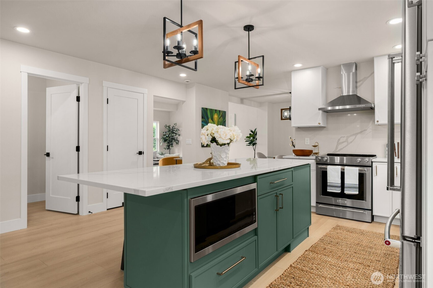 301 236th Place Southwest Bothell, WA 98021 - Photo 2 of 35 a kitchen with stainless steel appliances granite countertop a sink a stove and cabinets