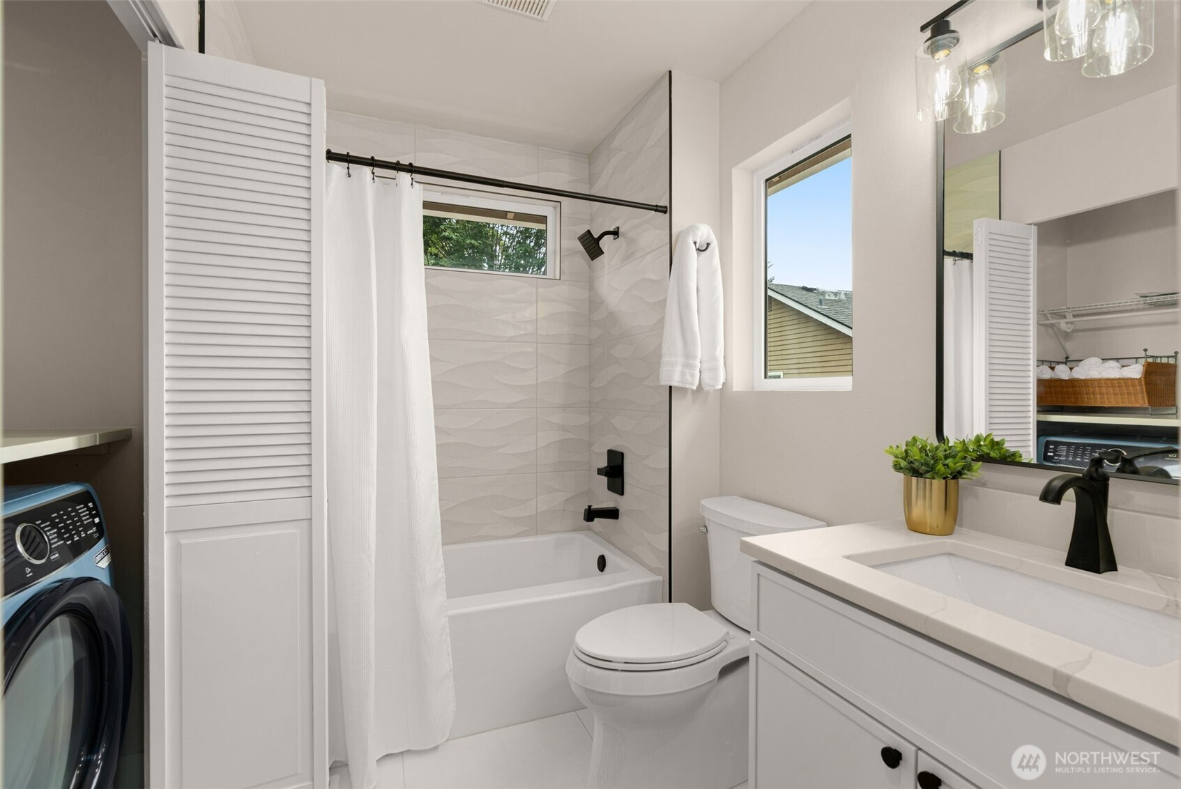 301 236th Place Southwest Bothell, WA 98021 - Photo 21 of 35 a bathroom with a sink a toilet and shower