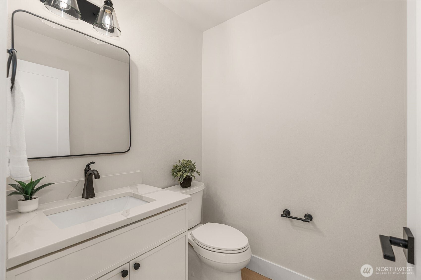301 236th Place Southwest Bothell, WA 98021 - Photo 22 of 35 a bathroom with a sink vanity granite toilet and a mirror