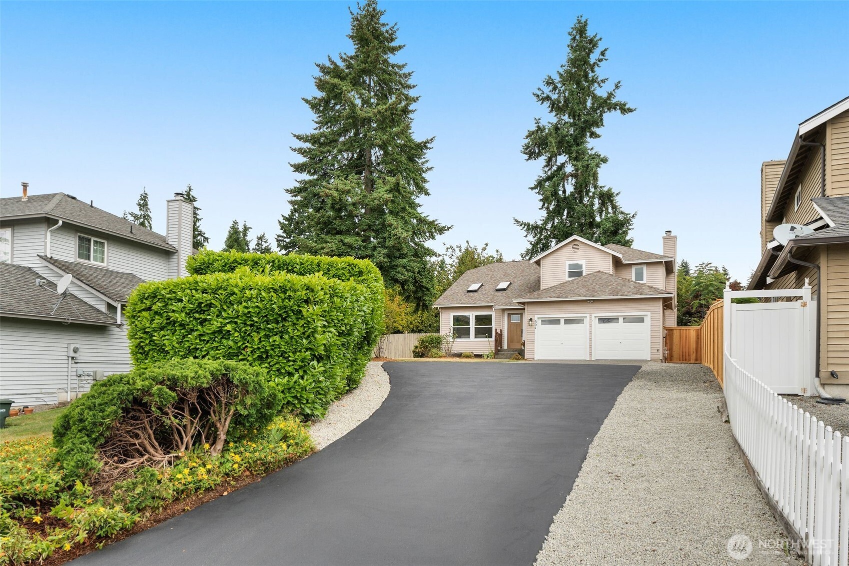301 236th Place Southwest Bothell, WA 98021 - Photo 23 of 35 a view of a house with a yard and potted plants