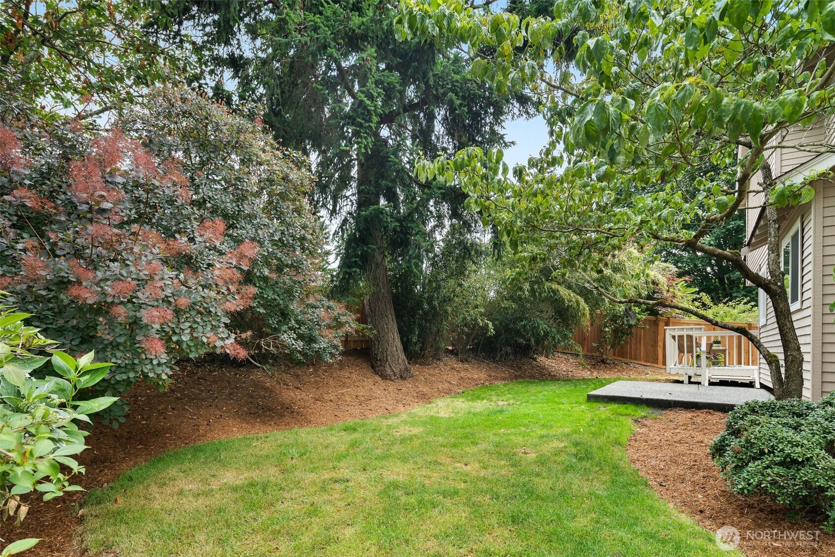 301 236th Place Southwest Bothell, WA 98021 - Photo 27 of 35 a view of a backyard with a garden