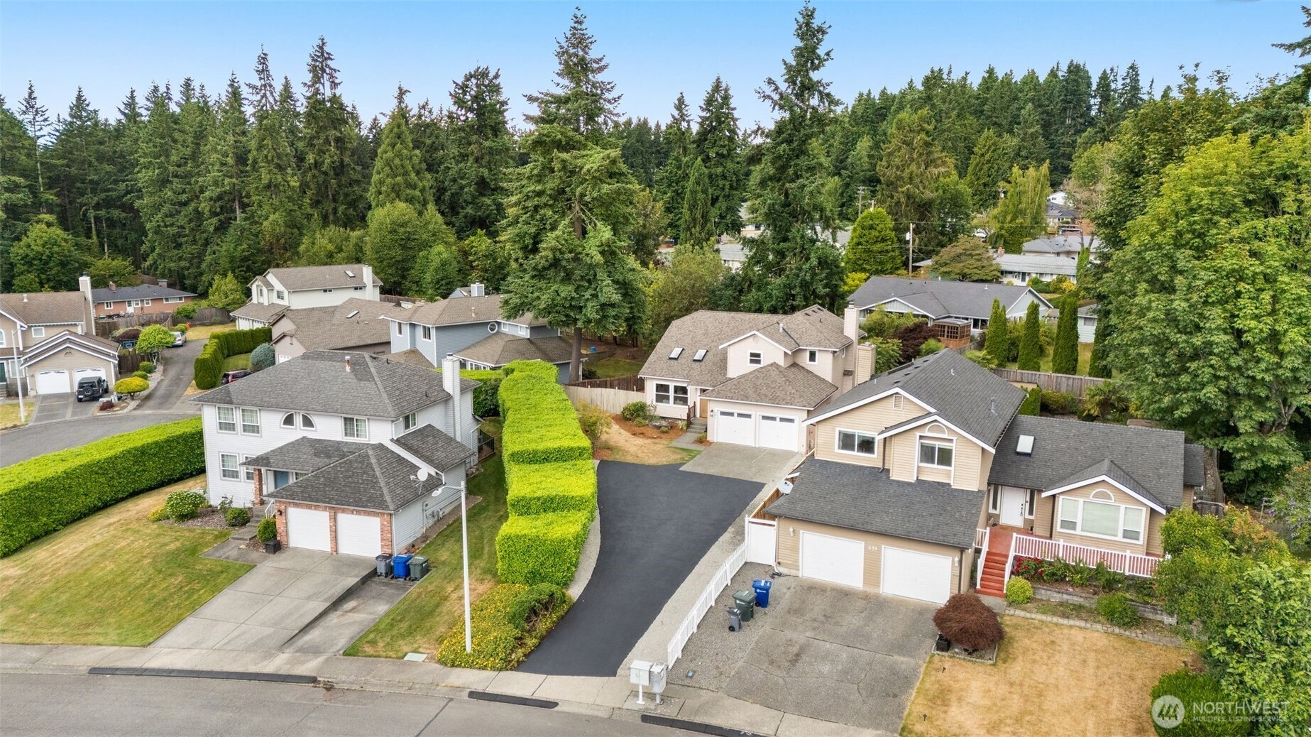 301 236th Place Southwest Bothell, WA 98021 - Photo 30 of 35 an aerial view of a house with swimming pool and garden
