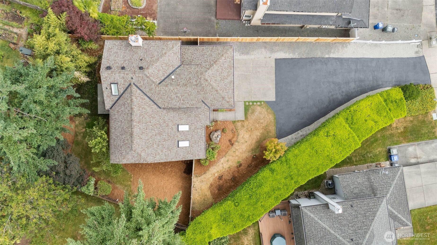 301 236th Place Southwest Bothell, WA 98021 - Photo 31 of 35 an aerial view of a house with a yard and large trees