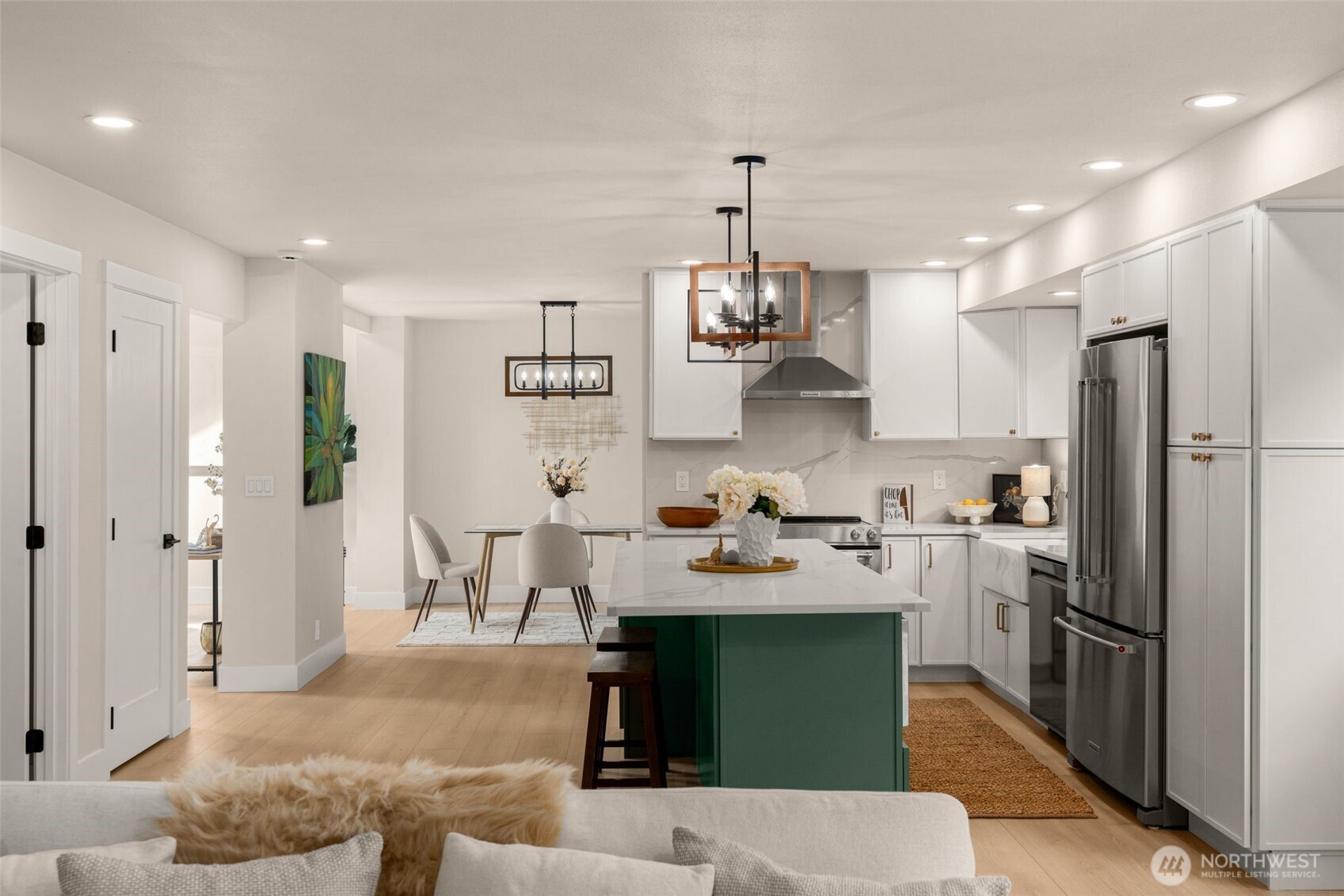 301 236th Place Southwest Bothell, WA 98021 - Photo 4 of 35 a kitchen with white cabinets and stainless steel appliances