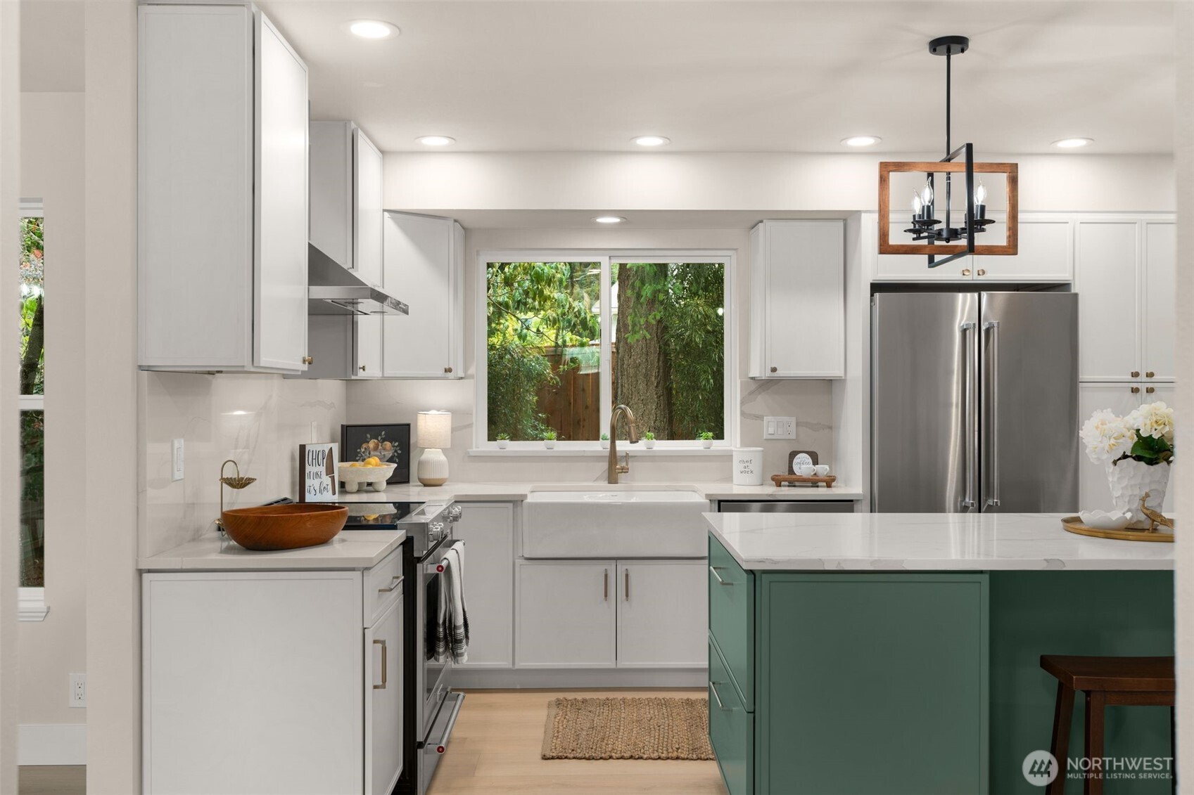301 236th Place Southwest Bothell, WA 98021 - Photo 6 of 35 a kitchen with kitchen island a sink stove and refrigerator