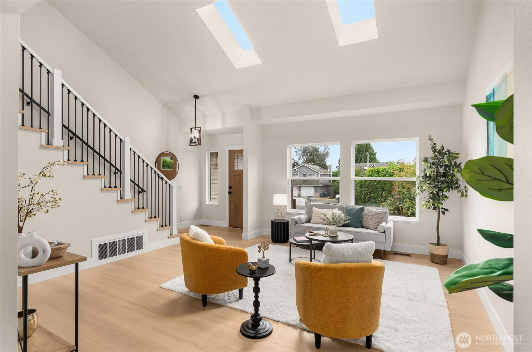 301 236th Place Southwest Bothell, WA 98021 - Photo 8 of 35 a living room with furniture and a large window