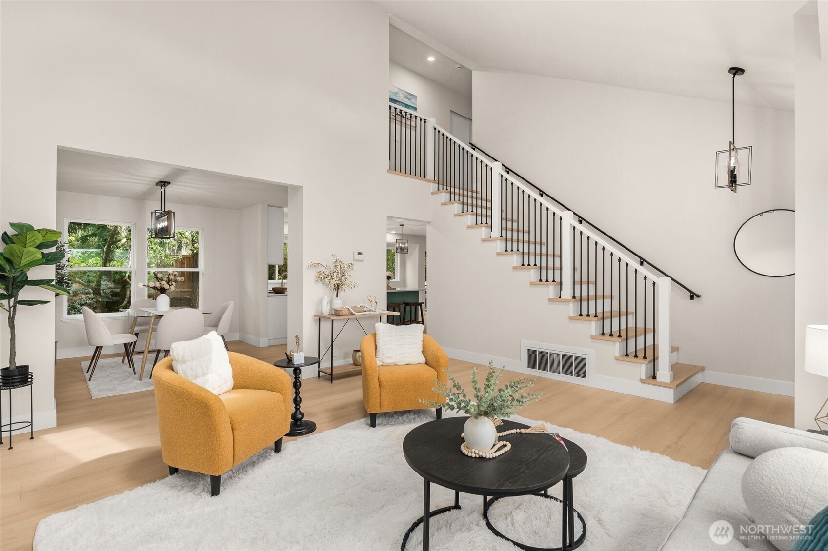 301 236th Place Southwest Bothell, WA 98021 - Photo 9 of 35 a living room with furniture and a table