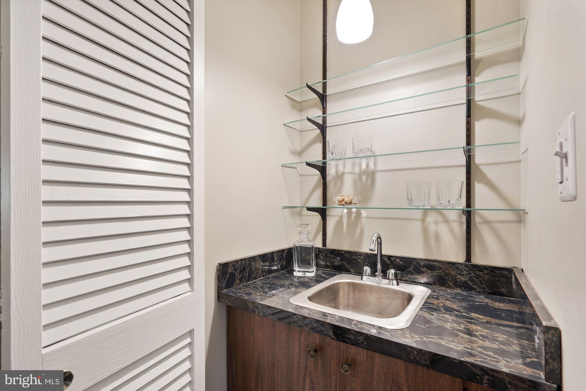 10805 Hunt Club Road Reston, VA 20190 - Photo 7 of 41 Wet bar between living room & family room