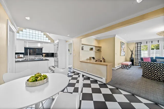 a kitchen with stainless steel appliances kitchen island granite countertop a sink and cabinets