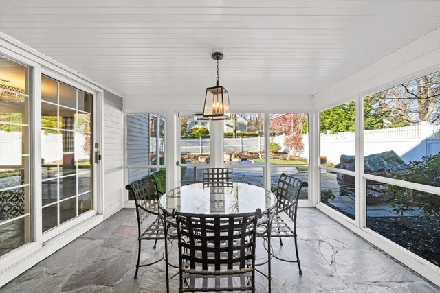 a dining room with furniture window and outside view