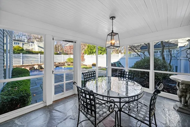 a dining room with furniture window and outdoor view
