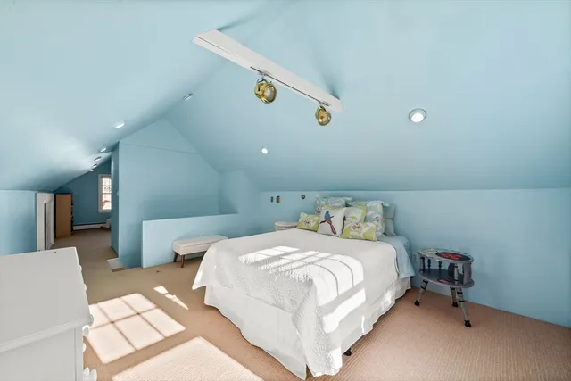 a bedroom with a bed and a table