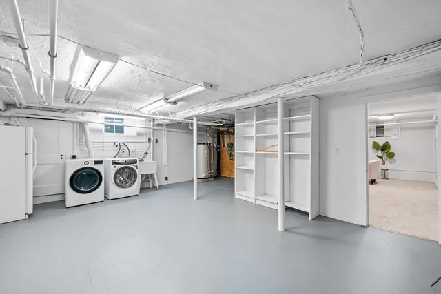a view of a storage & utility room with washer and dryer