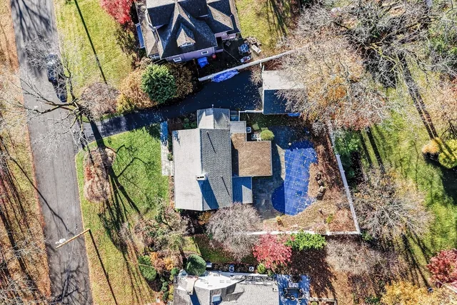 a view of balcony with wooden floor and potted plants