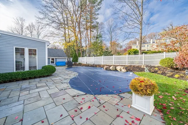 a view of a backyard with sitting area
