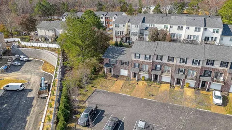an aerial view of a house with a swimming pool