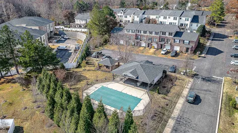 an aerial view of a houses with outdoor space