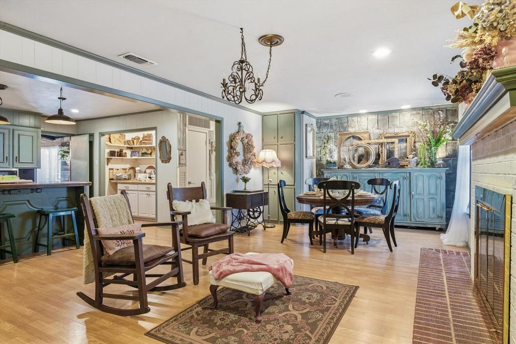 11571 Highway 19 Canton, TX 75103 - Photo 18 of 38 a living room with furniture a chandelier and a rug