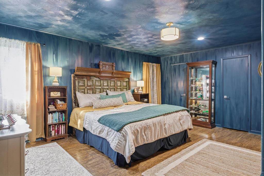 11571 Highway 19 Canton, TX 75103 - Photo 6 of 38 a bedroom with a large bed and a chandelier