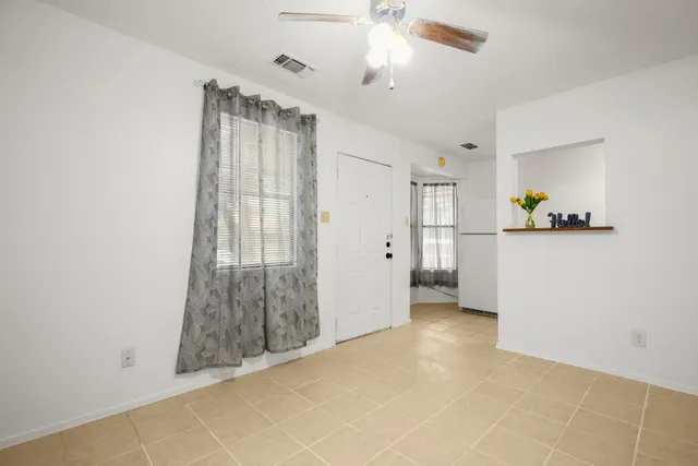 a view of livingroom with hardwood floor and a ceiling fan