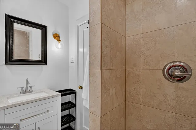 a bathroom with a sink and a mirror