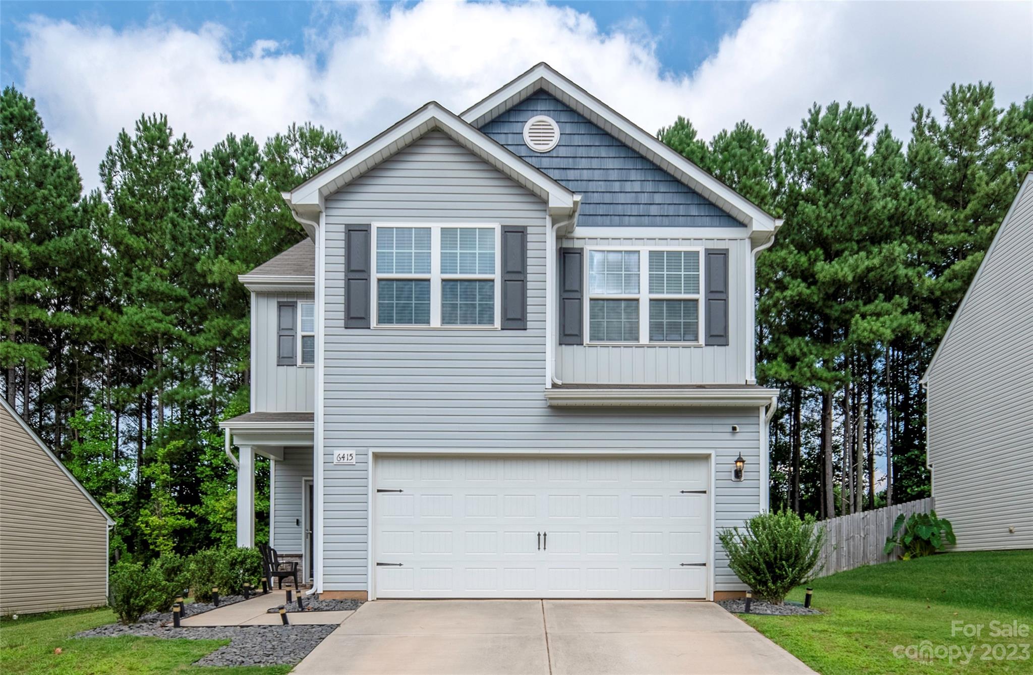 a front view of a house with a garage