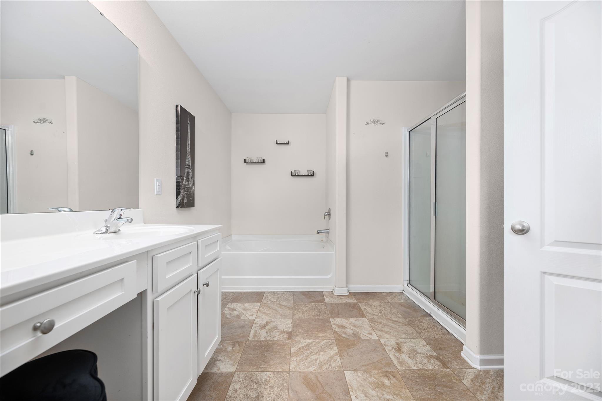 6415 Jerimoth Charlotte, NC 28215 - Photo 14 of 22 a bathroom with a tub sink and mirror