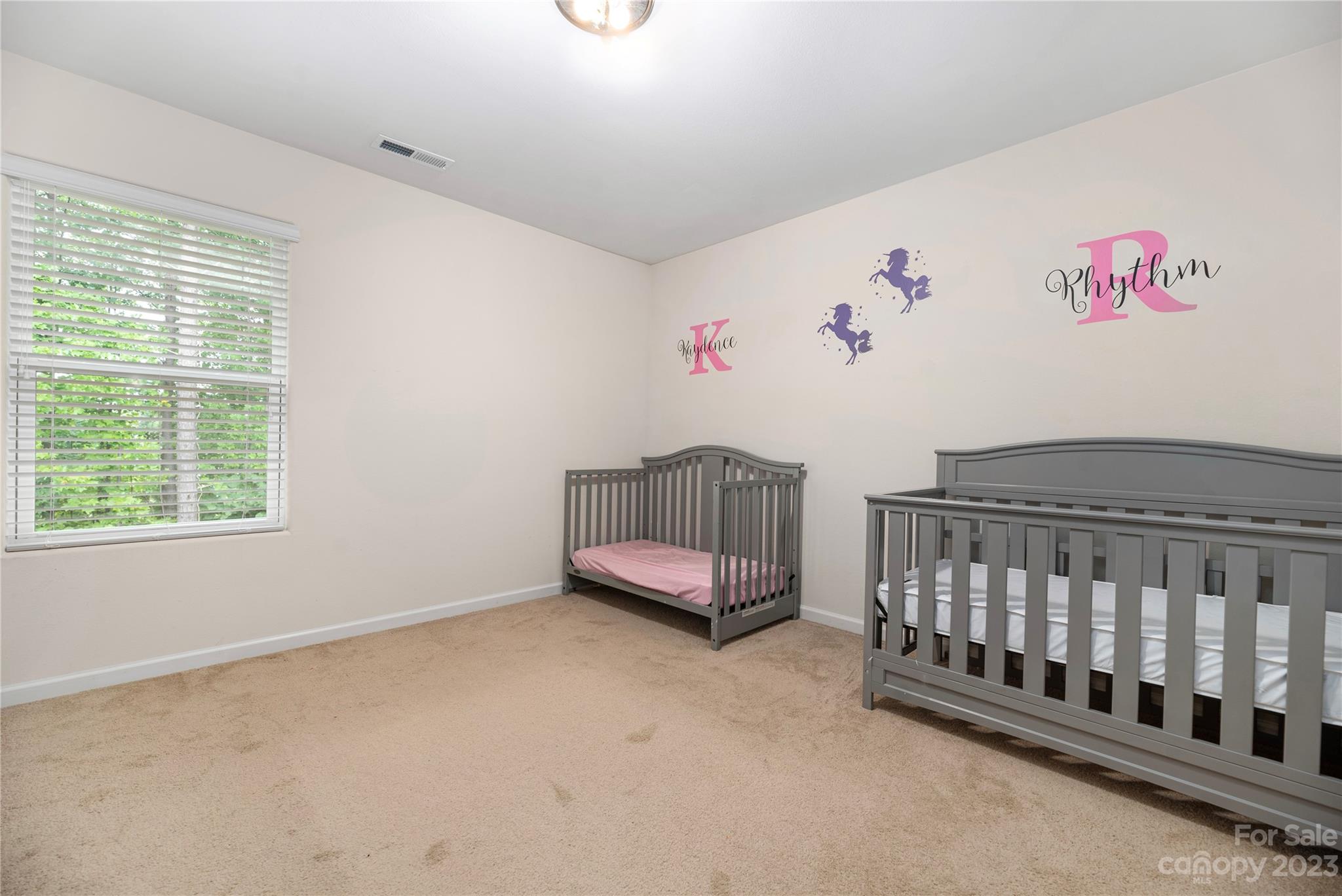 6415 Jerimoth Charlotte, NC 28215 - Photo 16 of 22 a spacious bedroom with a bed and a window