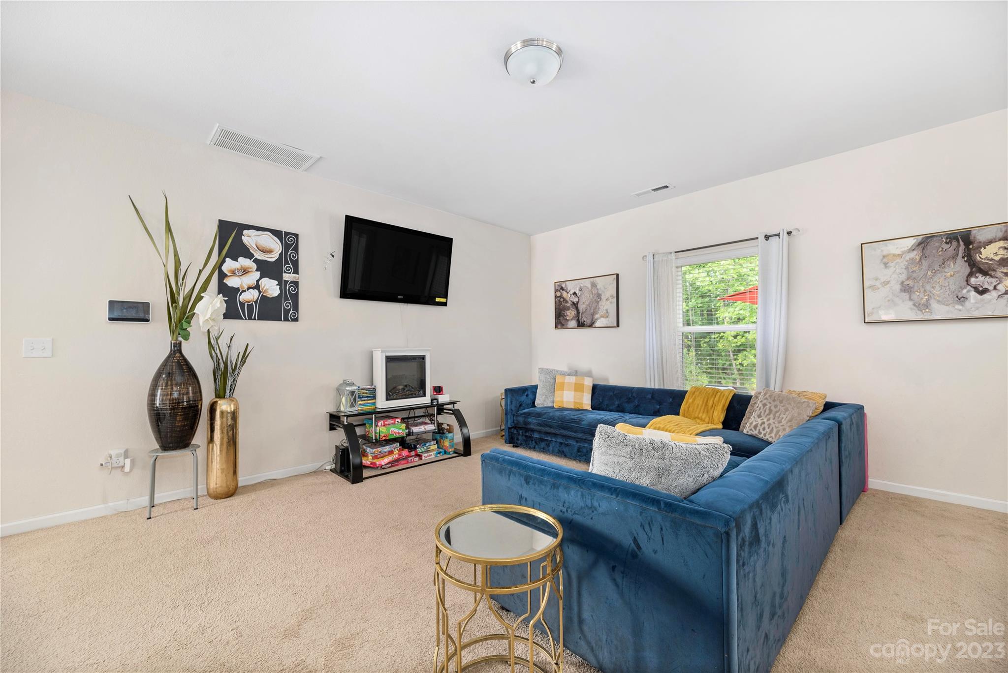 6415 Jerimoth Charlotte, NC 28215 - Photo 6 of 22 a living room with furniture a flat screen tv and a window