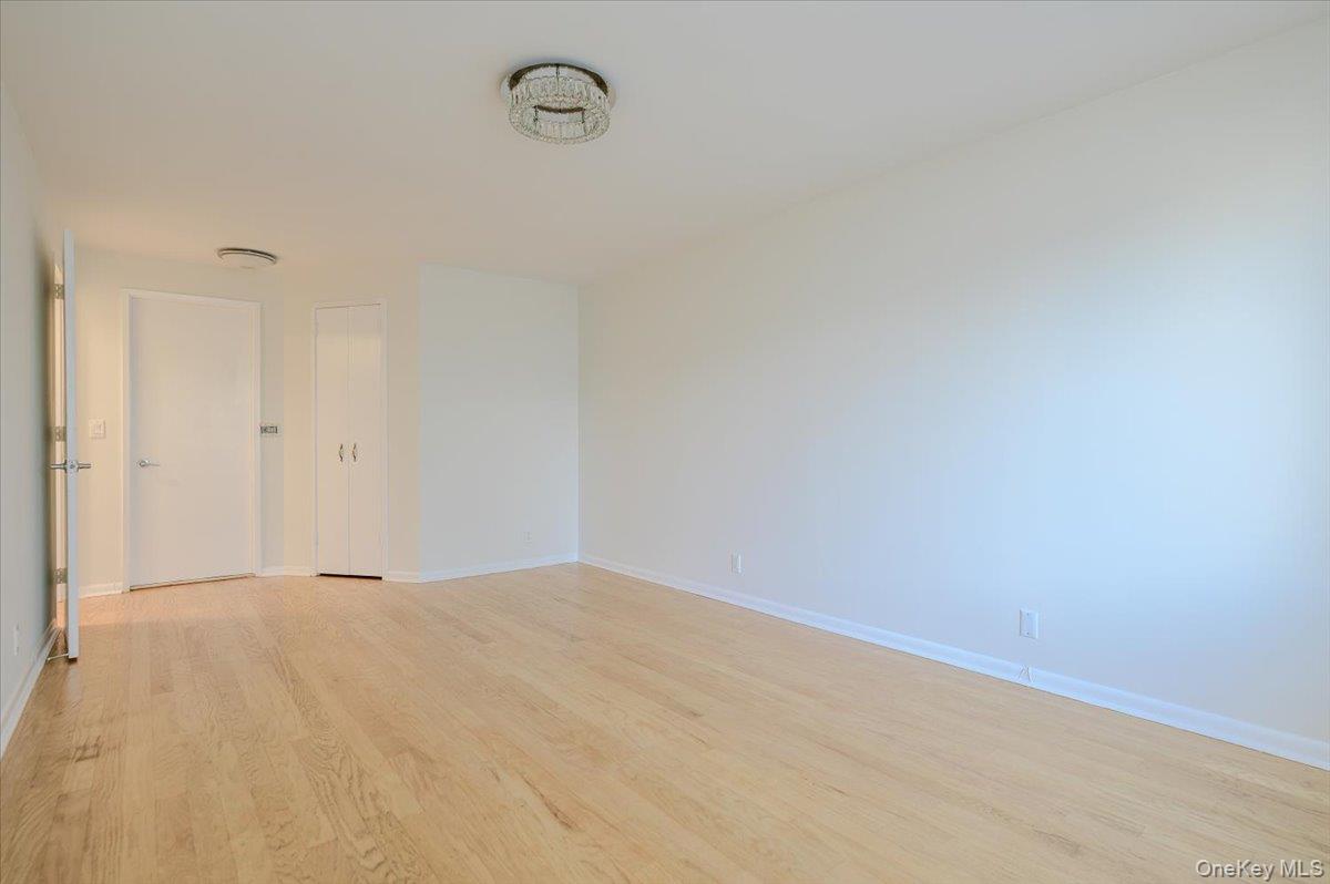 141 Great Neck Road, Unit 3F Great Neck, NY 11021 - Photo 16 of 24 Primary bedroom with full bath and walk in closet
