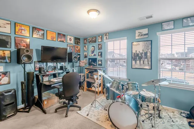 a bedroom with a bed and couch